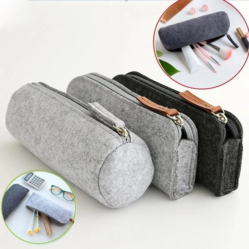 Set of gray pencil cases with zippers on a white background