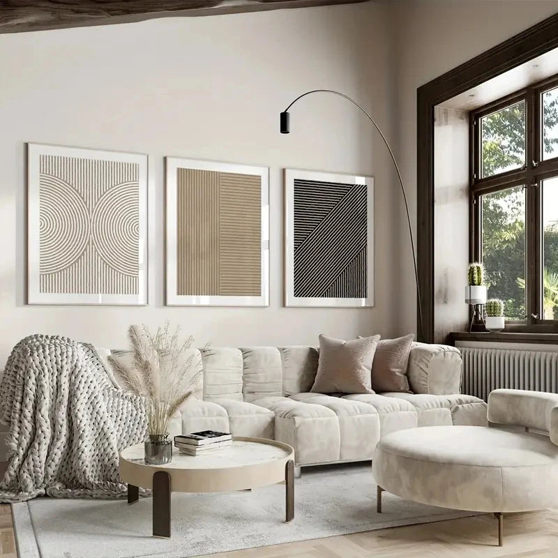 Modern living room with a beige sofa, coffee table, and decorative elements.